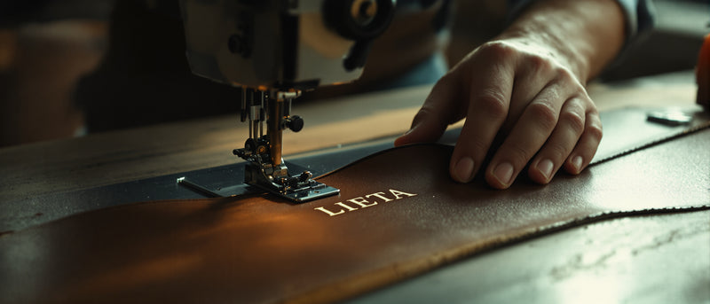 Inside a leather workshop in Scandicci, Italy — leather panel under the stitching machine.